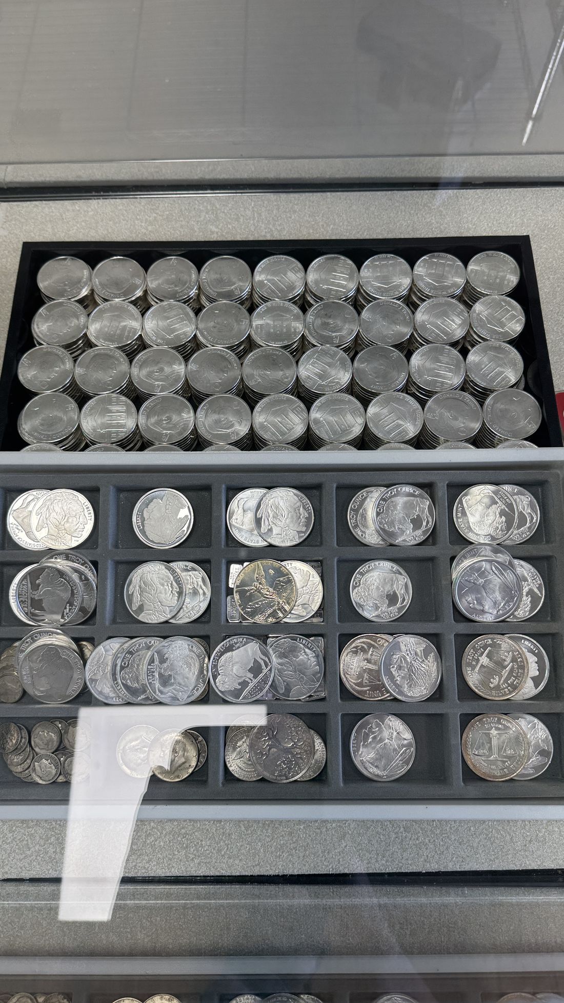 Organized trays of collectible silver coins