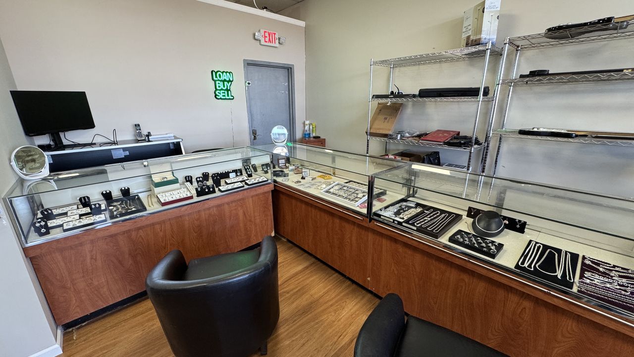Clean, well-lit showroom with jewelry counters and display cases